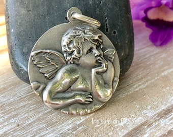 Raphael’s Cherub Pendant. Sterling Silver.