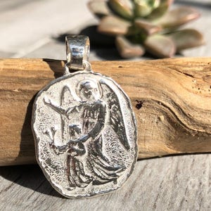 Guardian Angel Medal. Odd shape. Sterling Silver.