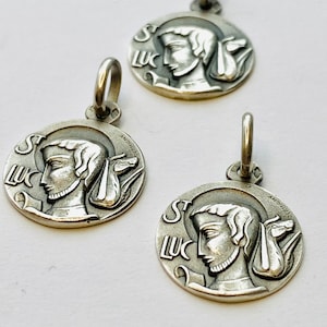Saint Luke Charm. Sterling Silver