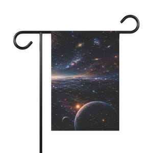 May include: A rectangular garden flag hanging on a black metal stand, featuring a deep space scene with a large dark planet in the foreground, a smaller moon, and a vast expanse of stars, nebulae, and distant galaxies in shades of blue and orange.