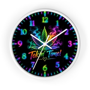 May include: A round wall clock with a white frame and a black face featuring a vibrant, rainbow-colored cannabis leaf surrounded by colorful smoke. The clock displays the text Tokin' Time! with a small heart and neon-style numbers 1 through 12.