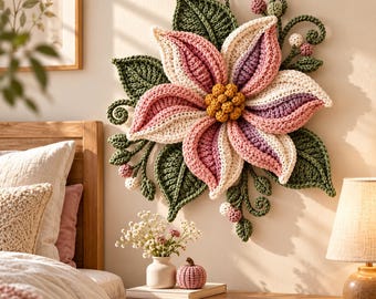 May include: A large, handcrafted crochet wall hanging featuring a central flower with layered petals in shades of cream, pink, and purple, surrounded by dark green crocheted leaves, vines, and small round berries, suspended from a small wooden hook.