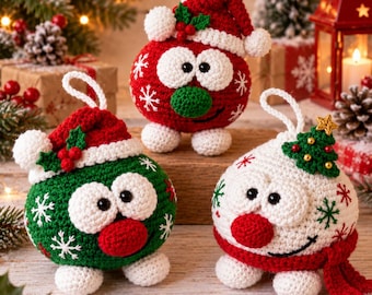 May include: Three round, crocheted Christmas ornaments featuring cartoon-like faces with large white eyes. One is red with a Santa hat, one is green with a Santa hat, and one is white with a red scarf and a small green Christmas tree decoration.