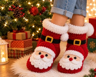 May include: A pair of red and white crochet slippers designed to look like Santa Claus, featuring a black belt with a yellow buckle, a white fluffy cuff, and a detailed face with a beard, moustache, and red nose on the front of each slipper.