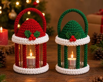 May include: Two cylindrical glass candle holders encased in crocheted covers. One cover is red and the other is green, both featuring white crocheted trim, a handle, and a decorative holly leaf and red berry applique on the front.