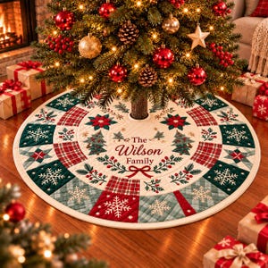 May include: A round, quilted Christmas tree skirt featuring a patchwork design of red, green, and cream squares with snowflake, poinsettia, and holly patterns. The center displays the text The Wilson Family in red script lettering.