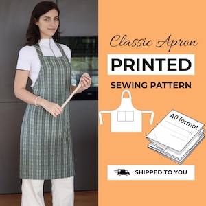 May include: A green and black plaid apron with thick shoulder straps and a straight neckline. The image includes text reading Classic Apron PRINTED SEWING PATTERN A0 format, along with a line drawing of the apron and a stack of paper patterns.