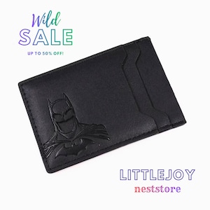 May include: A black rectangular card holder featuring an embossed Batman logo on the front. The text "Wild SALE UP TO 50% OFF!" appears in the top left corner, and "LITTLEJOY neststore" is printed in the bottom right corner of the image.