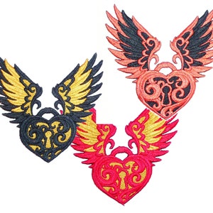 May include: Embroidered patches featuring heart-shaped lockets with keyholes and stylized wings. The patches are in black and gold, coral and black, and red and gold. The patches are likely for clothing or accessories.