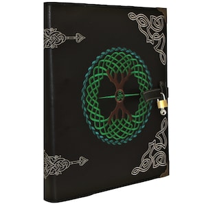 May include: Black leather journal with a Celtic knotwork design featuring a tree of life motif. The journal has a lock and key.