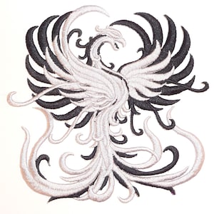 May include: Black and silver embroidered iron-on patch of a phoenix with its wings spread.