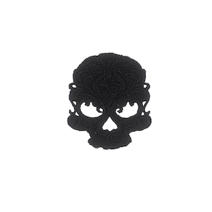 May include: Black embroidered skull patch with intricate details.