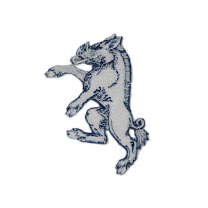 May include: Embroidered patch showing a light grey boar with dark blue stitching. The boar is in a standing pose, with one leg raised. The patch has a detailed design and is suitable for clothing or accessories.