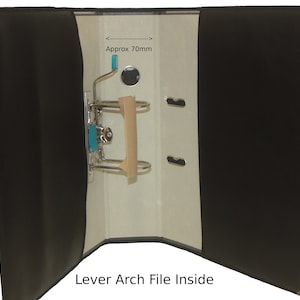 May include: Black lever arch file with a 70mm spine, open to reveal the inside of the file. The file has a metal lever mechanism and a brown cardboard insert.