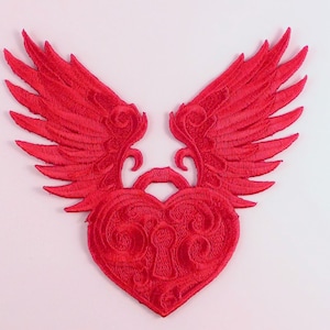 May include: Red embroidered patch of a heart with wings. The heart has a keyhole and intricate details.