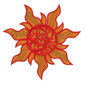 May include: Embroidered sun design in shades of orange and red. The sun has a detailed, swirling pattern in the center and pointed rays extending outward. The design is likely for patches, apparel, or craft projects.