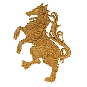 May include: A gold embroidered patch featuring a stylised wolf standing on its hind legs. The wolf is detailed with intricate swirls and curls.