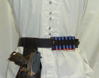 May include: A white button-down shirt with decorative buttons, a black belt with a holster and toy gun, and a belt with blue and orange toy bullets. The outfit is designed for cosplay or costume events.
