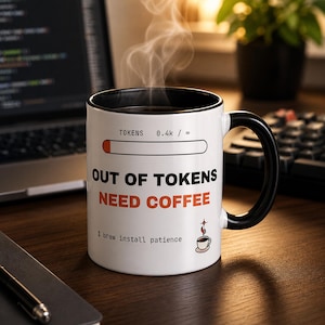 May include: A white ceramic mug with a black interior and handle, featuring a progress bar graphic labeled TOKENS 0.4k / ∞, the text OUT OF TOKENS NEED COFFEE, and the command $ brew install patience with a small coffee cup icon.