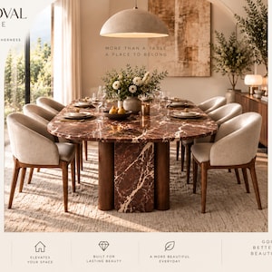 May include: An oval dining table with a dark red marble top and thick wooden legs, surrounded by eight light beige upholstered chairs with wooden frames. The table is set with plates, glasses, and a central vase of white flowers and pears.