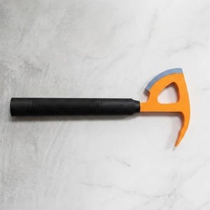 May include: A hand tool featuring a black textured cylindrical handle and an orange metal head with a triangular cutout. The head includes a curved, light blue blade edge on the top and a pointed, downward-curving claw on the bottom side.