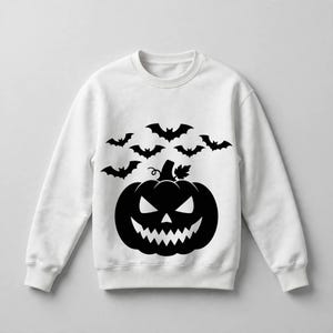 May include: A white long-sleeve sweatshirt featuring a large black graphic print on the front. The design displays a central jack-o'-lantern pumpkin with a jagged, toothy grin and triangular eyes, surrounded by a cluster of six flying bats above.