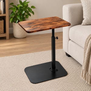 May include: A C-shaped side table featuring a rectangular tabletop with a rustic brown wood grain finish. The table has a black metal base and a single vertical support column with an adjustable height mechanism controlled by a side knob.