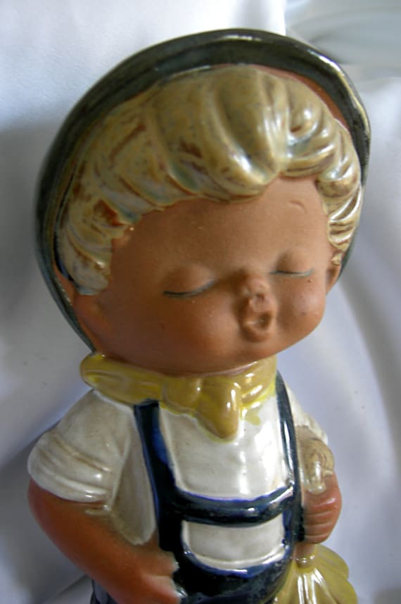 whistling boy figurine