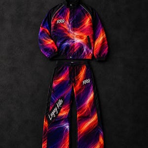 May include: A matching jacket and pants set featuring a vibrant abstract print of swirling red, orange, and purple flames. The jacket has a high collar and black sleeves. The pants have a drawstring waist and the text RRG and Legacy Kills.