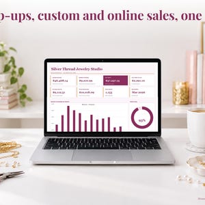 Jewelry bookkeeping spreadsheet annual dashboard open on a laptop on a desk
