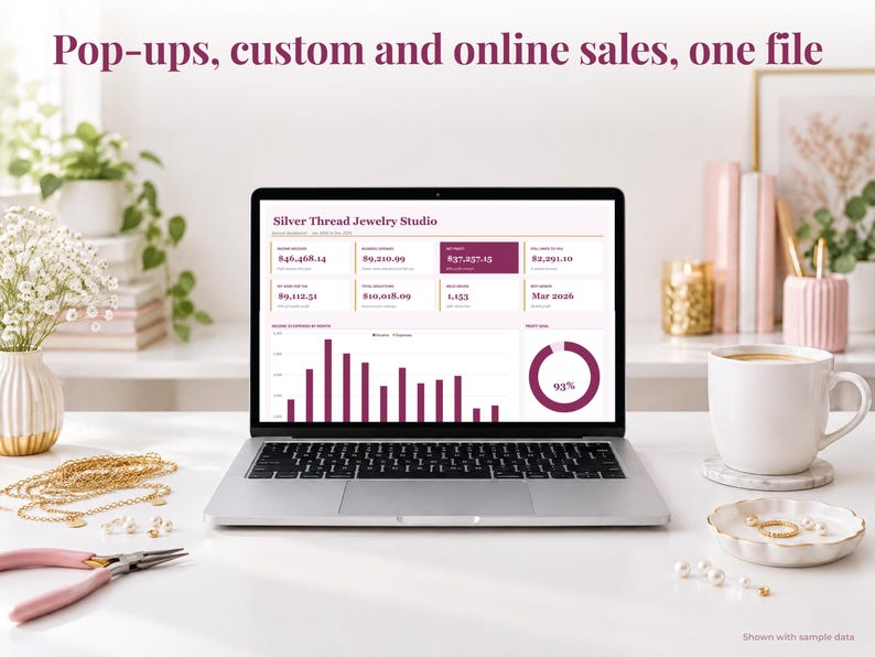 Jewelry bookkeeping spreadsheet annual dashboard open on a laptop on a desk