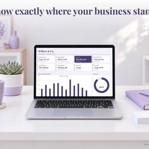 Small Business bookkeeping spreadsheet annual dashboard open on a laptop on a desk