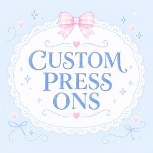 May include: A light blue graphic featuring a white lace doily frame with a pink gingham bow at the top. The text CUSTOM PRESS ONS is written in blue in the center. The design is decorated with small pink hearts, blue stars, and blue bows.