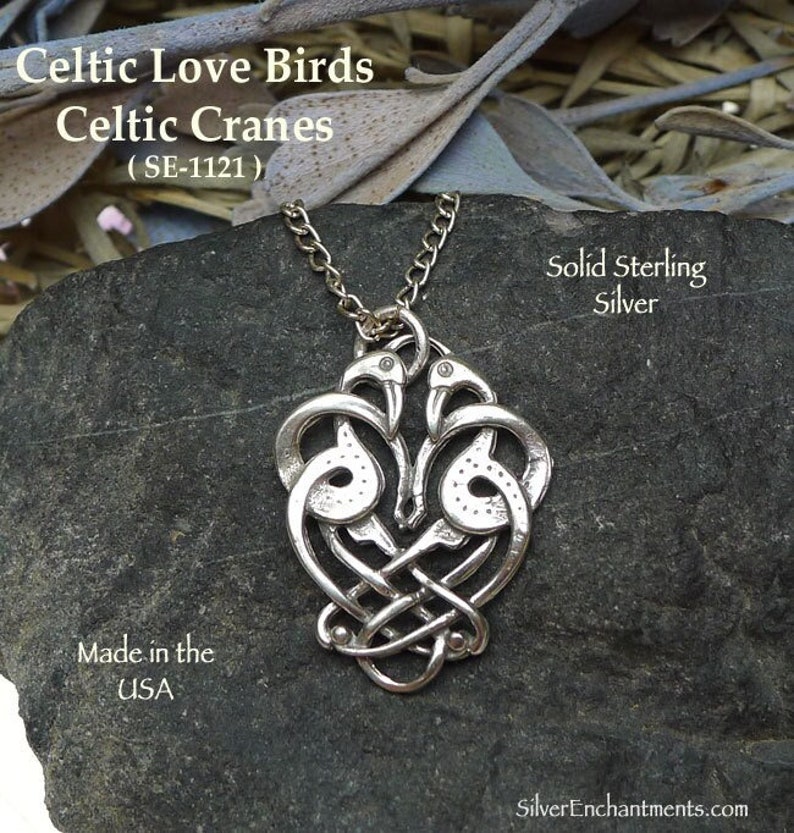 Sterling silver Celtic love birds necklace with two cranes intertwined in a heart shape. The necklace is made of solid sterling silver and is made in the USA. Enhance your jewelry collection with this Solid Sterling Silver Celtic Love Birds Pendant, a handcrafted piece that embodies the timeless symbolism of love, unity, and connection. Detailed depiction of Celtic zoomorphic birds, often interpreted as cranes or love birds a symbol of soulmates and enduring relationships in Celtic culture.