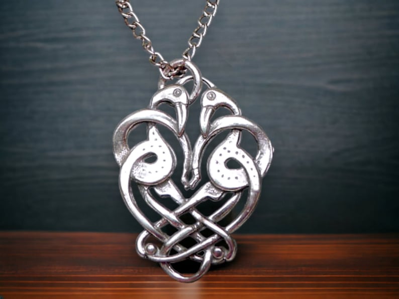Enhance your jewelry collection with this exquisite Solid Sterling Silver Celtic Bird Pendant, a perfect addition for lovers of Celtic symbolism and craftsmanship. Designed and hand-crafted in the United States