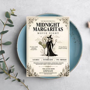 May include: A rectangular invitation card with cream background and black text reading Midnight Margaritas Movie Night. It features a central illustration of a witch holding a margarita glass and wand, surrounded by candles, text, and decorative borders.