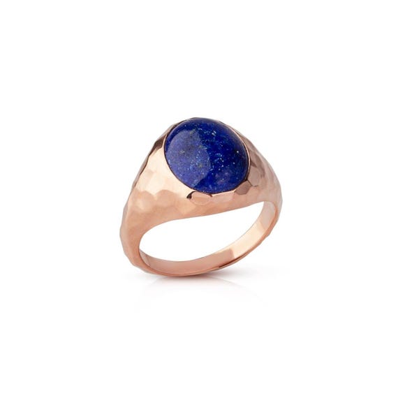 Hand-forged 14K gold signet ring with a hammered texture and deep blue lapis lazuli — genuinely one-of-a-kind artisan metalwork that looks like it belongs in an antiquities museum.