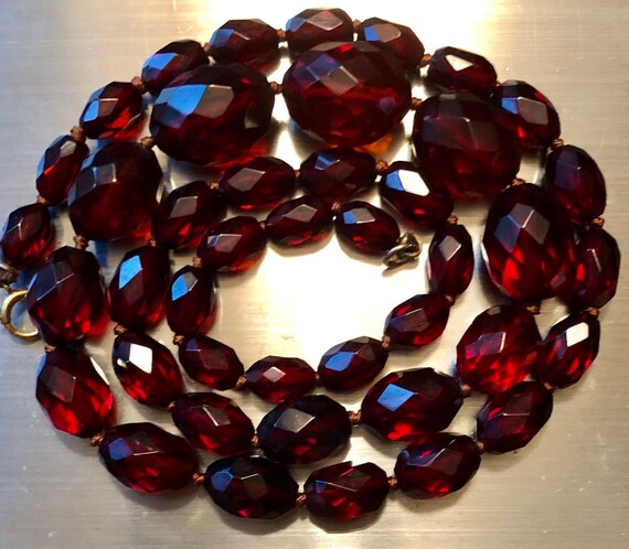 Cherry Amber Bakelite Necklace 21 Inch Long Faceted Cherry Amber