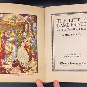 May include: An open book featuring a vibrant illustration of a royal court on the left page. The right page displays the title "THE LITTLE LAME PRINCE" and author details. The book is published by Whitman Publishing Co.