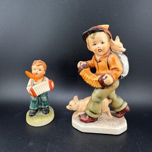 2 Vtg Figurines Friedel Bavaria Young Boy Playing Concertina Accordion for Pigs Piglets & Royal Crown Japan Hummel Clone Little Musician