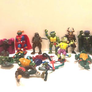 Vtg 1990s Teenage Mutant Ninja Turtles TMNT Action Figure Collection w Parts Weapons Bodacious Bikers Dinosaur Donatello Sewer Heroes