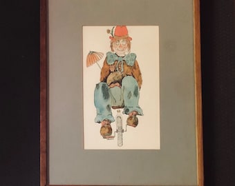May include: A framed illustration of a clown riding a unicycle. The clown is wearing a red hat, blue pants, and a brown jacket. The clown is holding a red and white umbrella.