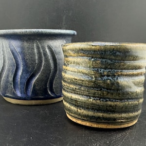 May include: A rustic wooden sign with the text "Welcome to our home" in white lettering. The sign features a distressed finish and a simple, inviting design, perfect for front door decor.