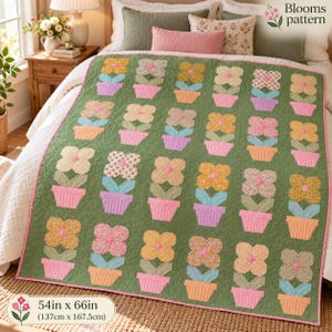 May include: A green quilt featuring a repeating pattern of potted flowers in various pastel colors and floral prints. The quilt has a pink border and measures 54 inches by 66 inches. The text Blooms pattern is visible in the corner.