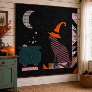 May include: A square quilt featuring a black background with a large white crescent moon, a teal cauldron with bubbles, and a purple checkered cat wearing an orange witch hat. The right border displays a vertical row of colourful fabric triangles.