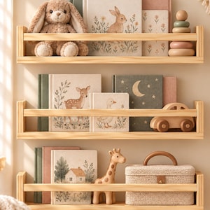 May include: Three light-colored wooden wall shelves holding books and toys. Items include a plush rabbit, a wooden stacking toy, a wooden car, a giraffe figurine, and a textured storage box. The books feature illustrations of a rabbit, a deer, a duck, a moon, and a house.