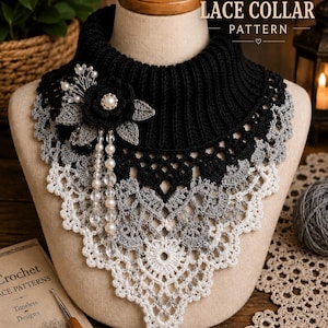 May include: A crochet lace collar featuring a black ribbed neck, transitioning into a grey and white intricate lace pattern. It is adorned with a black crocheted flower, grey leaves, and dangling white pearl and clear crystal bead accents.
