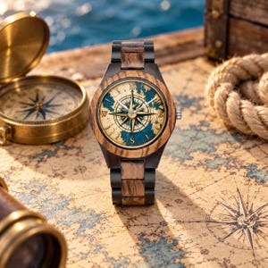 May include: A wristwatch with a dark wood and black metal link band. The watch face features a vintage-style map background in beige and blue with a central compass rose design, gold-toned hands, and a circular wood bezel surrounding the dial.