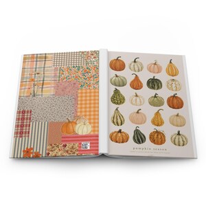 May include: An open book featuring a left page with a patchwork collage of plaid, floral, and striped patterns in orange, pink, and blue, and a right page displaying a grid of various illustrated pumpkins with the text pumpkin season at the bottom.
