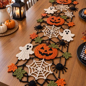 May include: A long, rectangular Halloween-themed crochet table runner featuring a repeating pattern of orange jack-o'-lanterns, white spiderwebs, white ghosts, black spiders, and small orange and green maple leaves connected by black yarn.